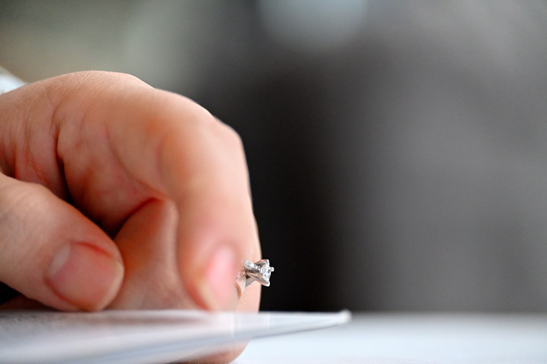 a-close-up-of-a-person-writing-on-a-piece-of-paper-pycx0hvbjmc